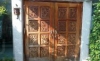 ［Before］焼け、汚れ、傷など経年変化により傷んでしまったチーク材の手彫り無垢の玄関ドア。約30年使用。